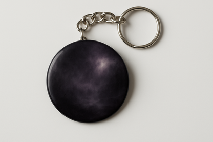 2.25 button keychain on a chain with a moody design