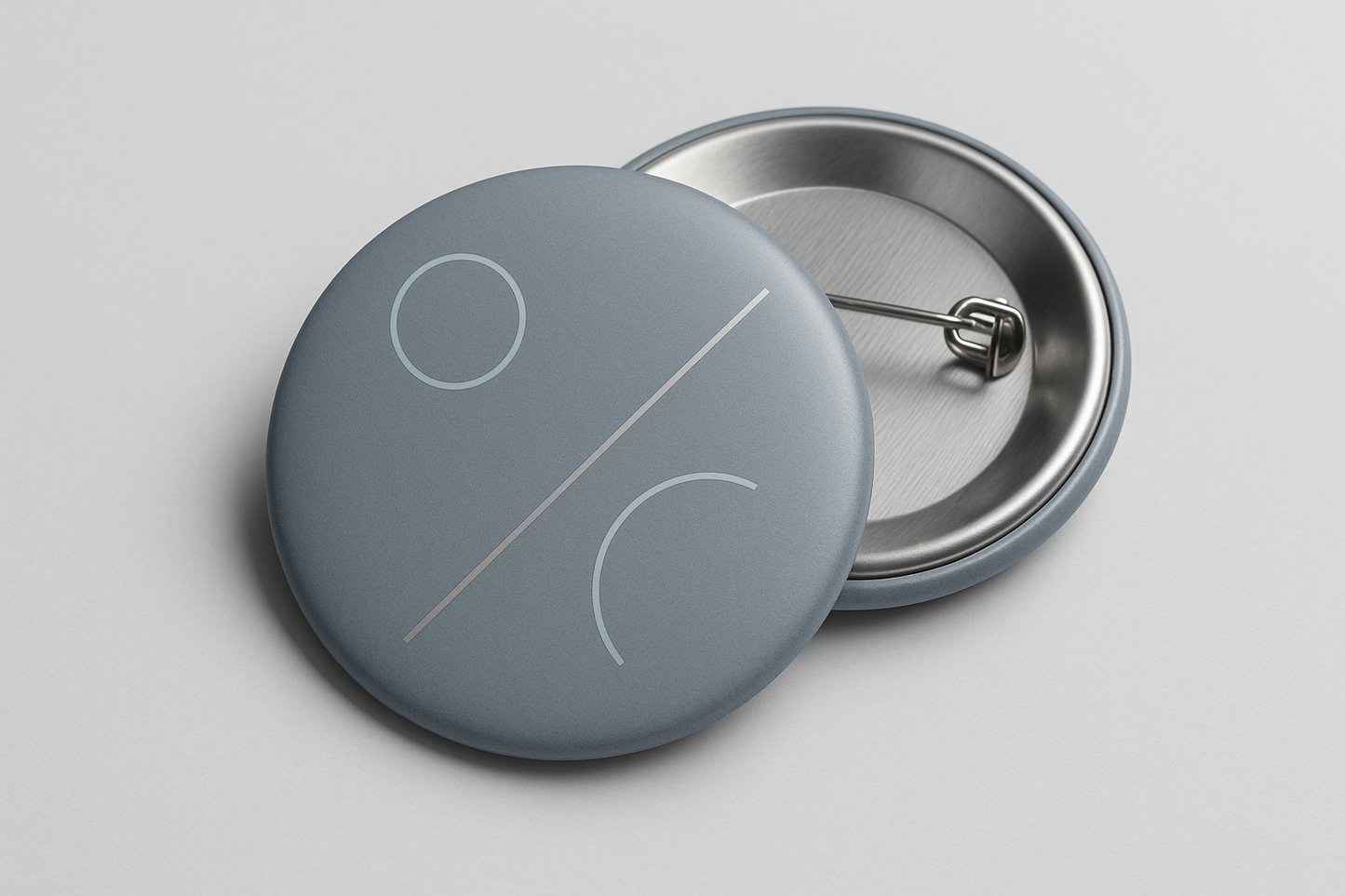 pin back button that is neutral and cool in color and design